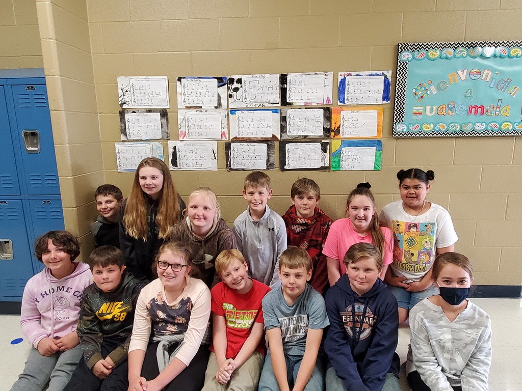 students in front of music display