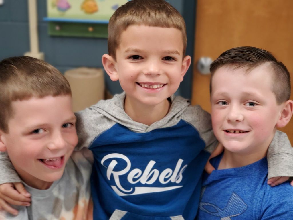 3 boys smiling