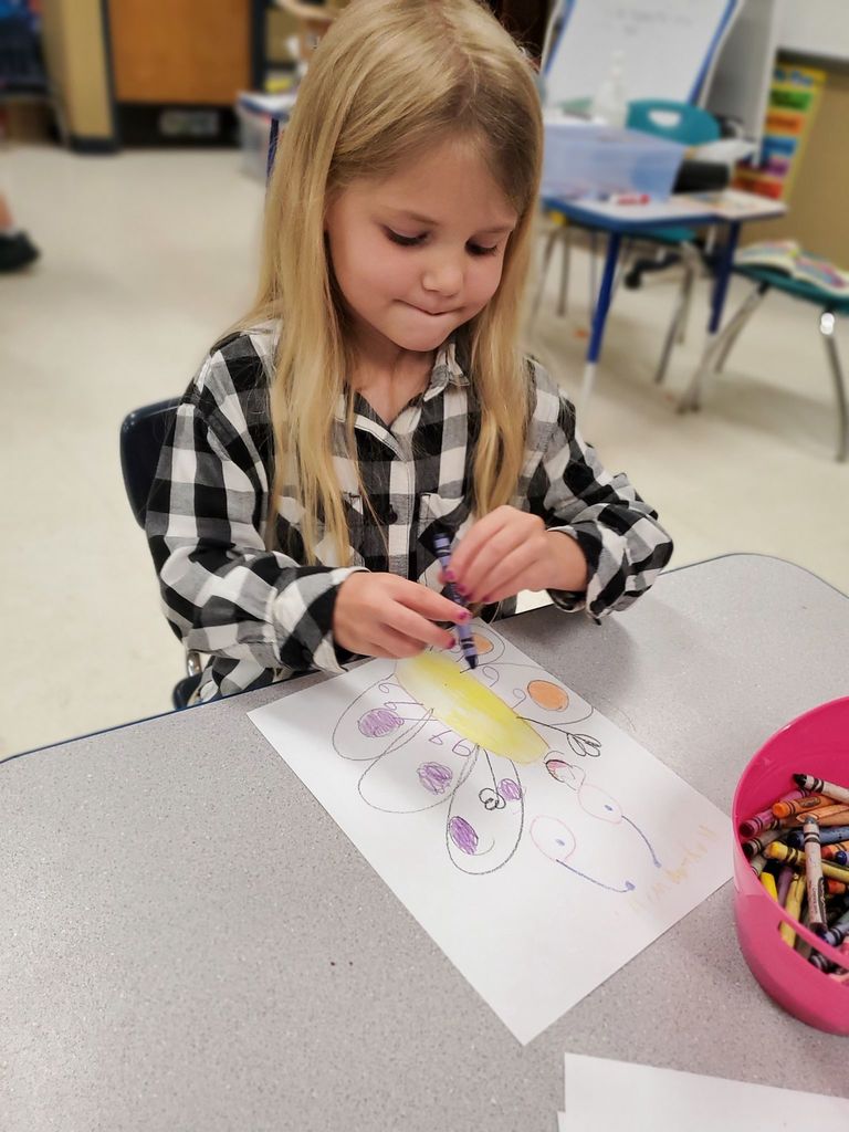 girl drawing a butterfly