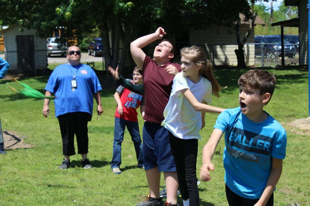 kids throwing rubber chickens