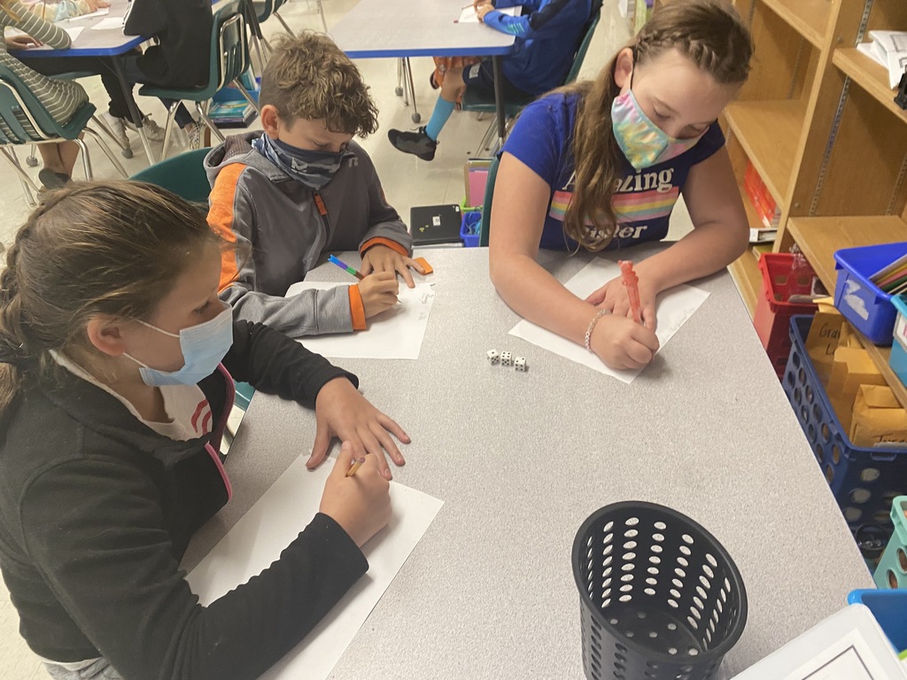 Kids writing on paper