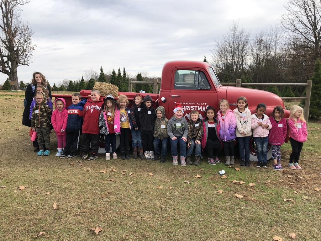class in front of truck