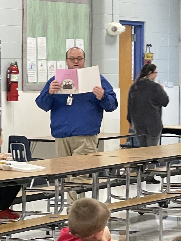man showing picture in book