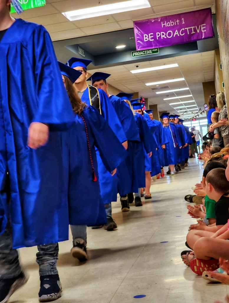 seniors walking down student lined hall