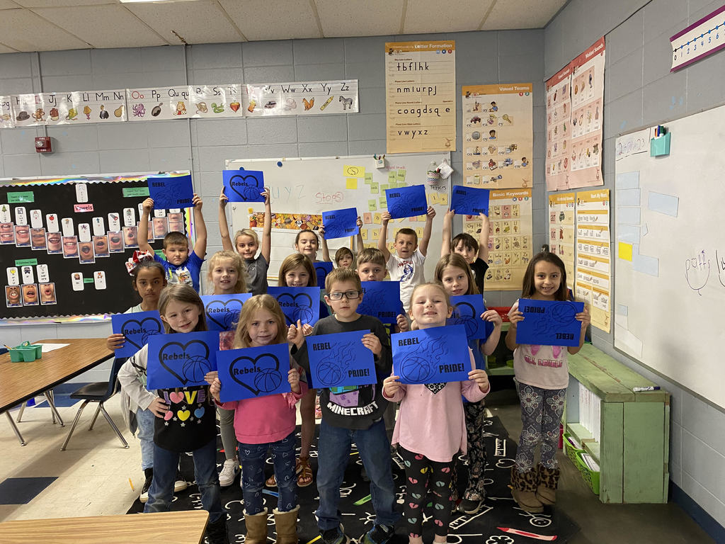 class holding signs