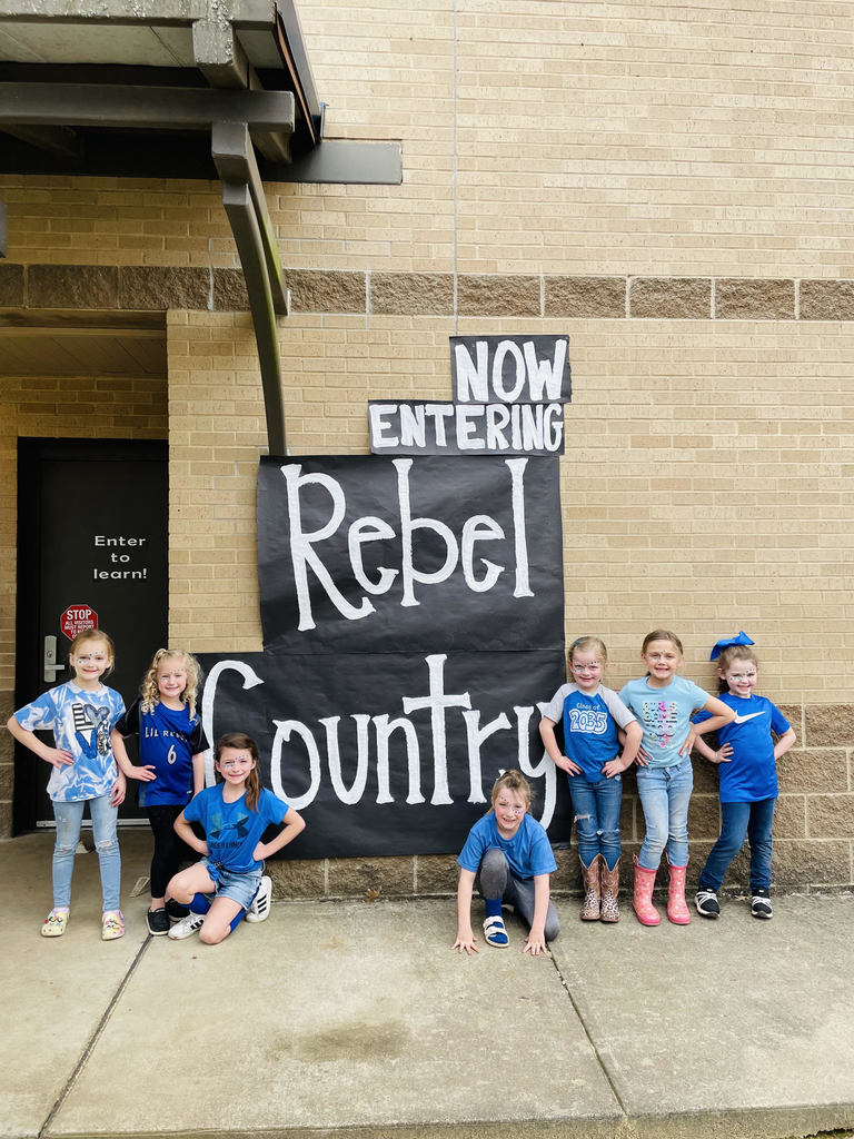 kids in front of sign